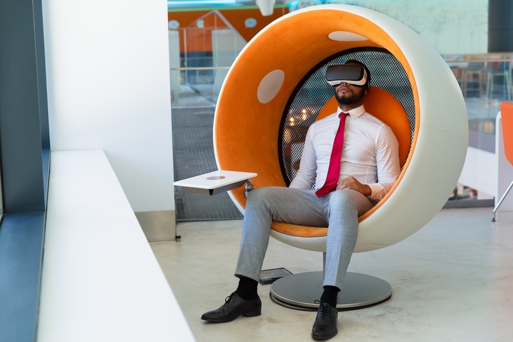 peaceful businessman About Using VR headset enjoying virtual video